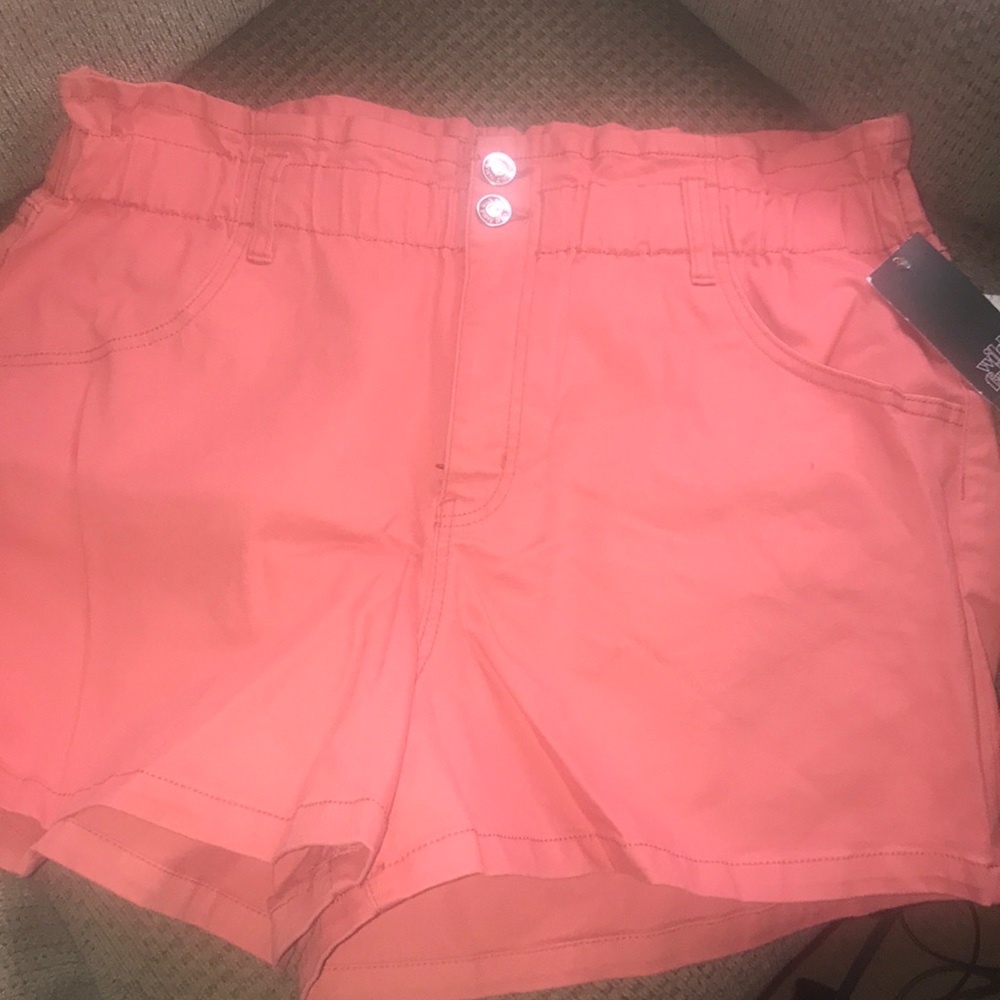 Coral pink color shorts.